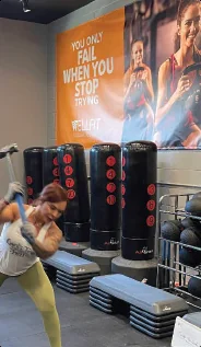 A Wellfit poster on the gym wall